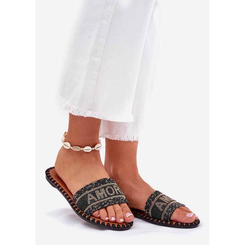 Flat -heeled women's flip flops with black decoration 1