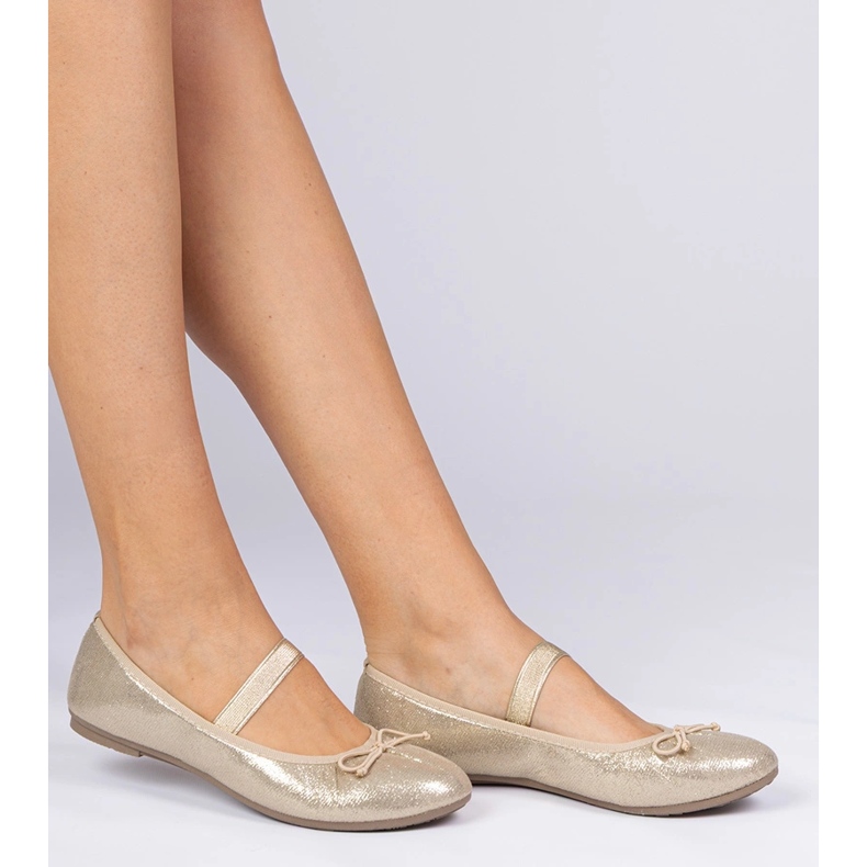 Golden women's ballerinas with a bow on an elastic band 1