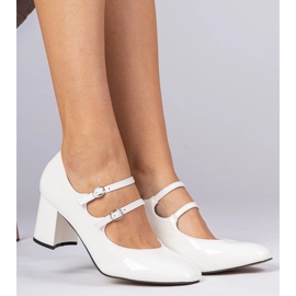 White women's pumps on the pillar with buckles 1