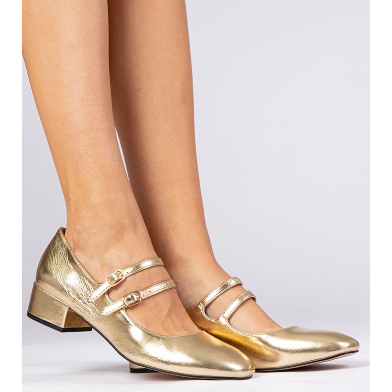 Golden women's pumps on the pillar with buckles 1 Golden women's pumps on the pillar with buckles 1