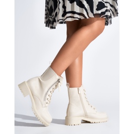 Beige patent leather women's ankle boots on a platform 2