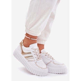 Women's sneakers on the gold platform golden 1