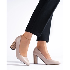 Ladies' beige pumps on the post 1