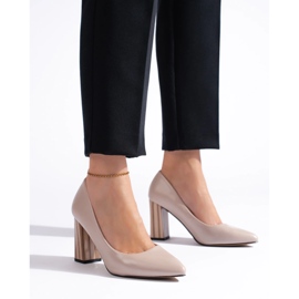 Ladies' beige pumps on the post 2