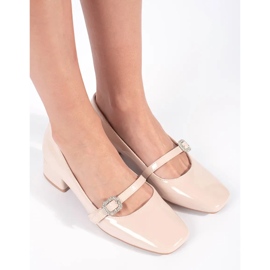 Beige patent heel pumps with a buckle 2