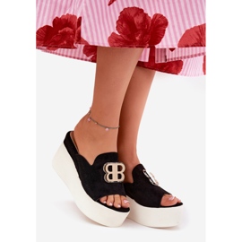 Slippers on the platform and wedges with a black decoration 1