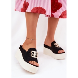 Slippers on the platform and wedges with a black decoration 2