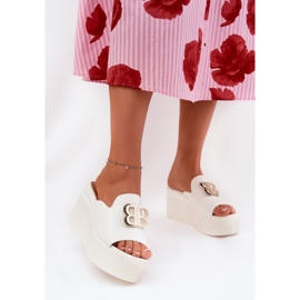 Slippers on the platform and wedges with a white ornament 2