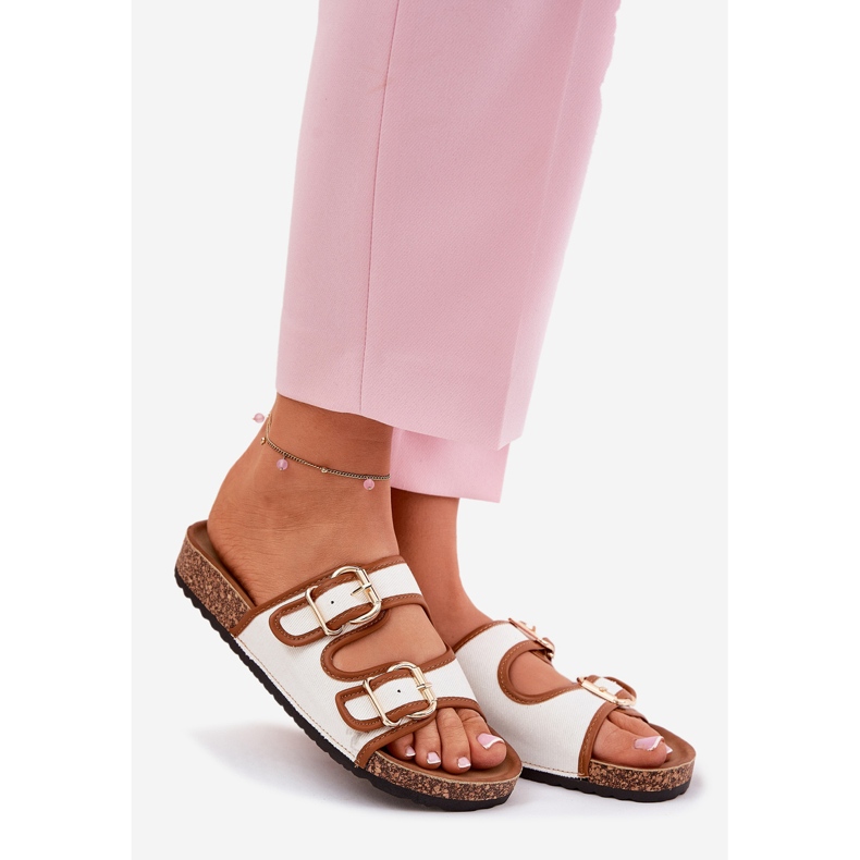 Women's material flip flops on a cork platform with white buckles 1