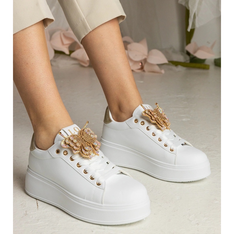 White and gold sneakers decorated with a butterfly with zircons 1