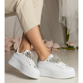 White and silver sneakers decorated with a butterfly with zircons 1 White and silver sneakers decorated with a butterfly with zircons 1