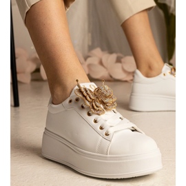 White sneakers decorated with a butterfly with zircons 1