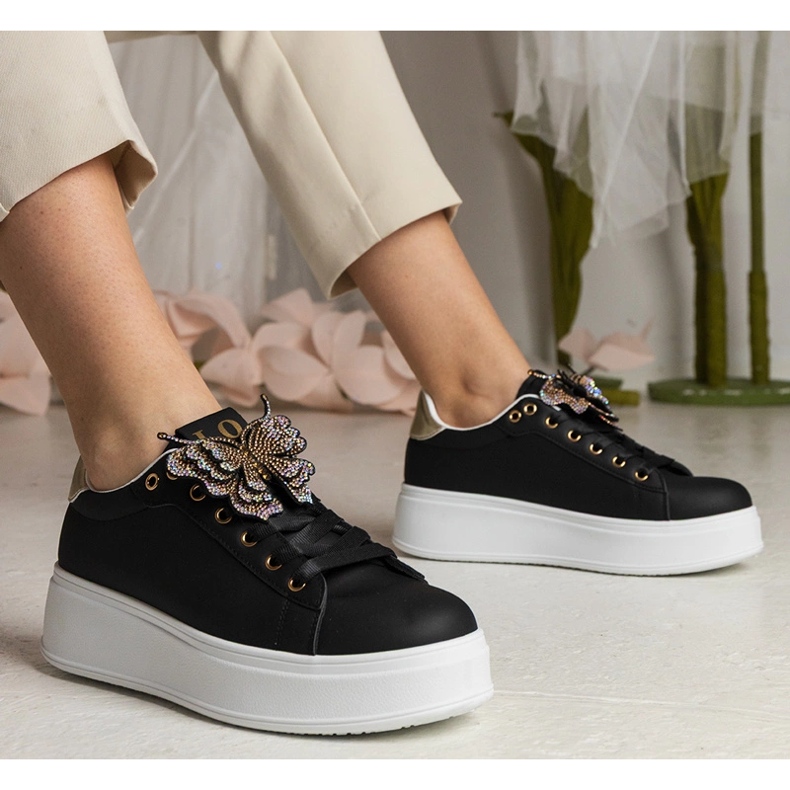 Black sneakers decorated with a butterfly with zircons 1 Black sneakers decorated with a butterfly with zircons 1