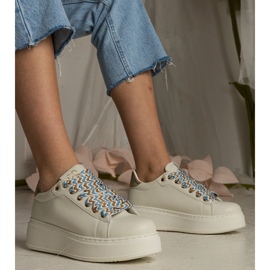 Beige women's sneakers with massive lacing 1