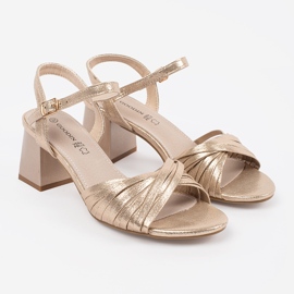 Goodin Golden elegant sandals on a low post 2