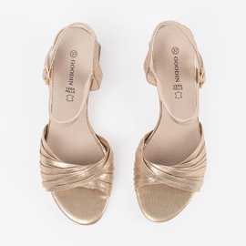 Goodin Golden elegant sandals on a low post 5