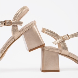 Goodin Golden elegant sandals on a low post 1