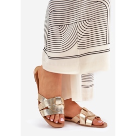 Flat women's flip flops with intertwining golden stripes 1