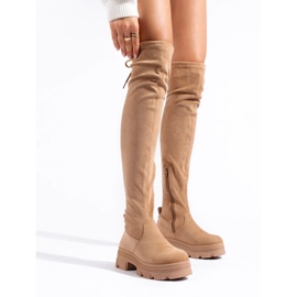 Women's thigh-high boots on a beige platform 2