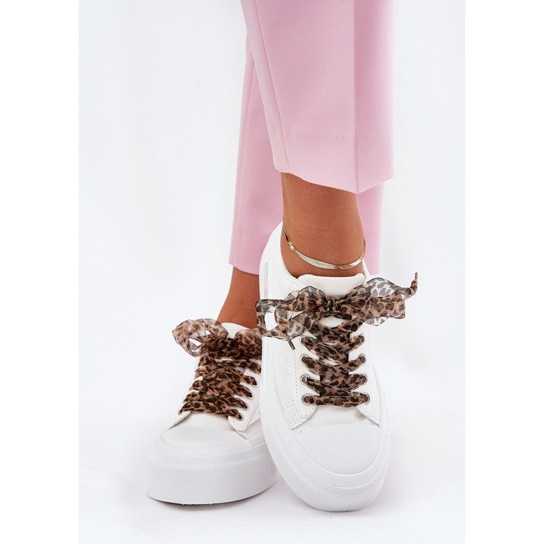 Women's sneakers on a massive platform with decorative lacing white 1 Women's sneakers on a massive platform with decorative lacing white 1