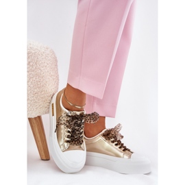 Women's sneakers on a massive platform with decorative lacing gold golden 1