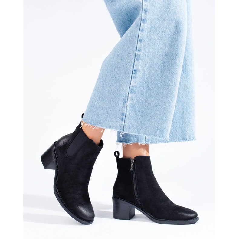 Ladies' black Chelsea boots on the post 2