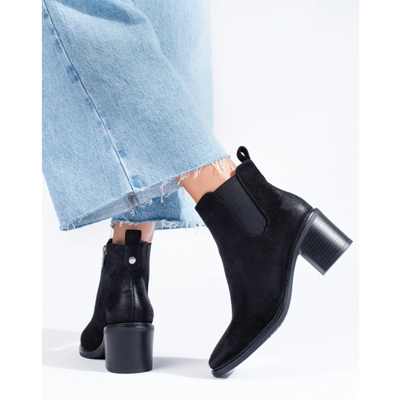 Ladies' black Chelsea boots on the post 1