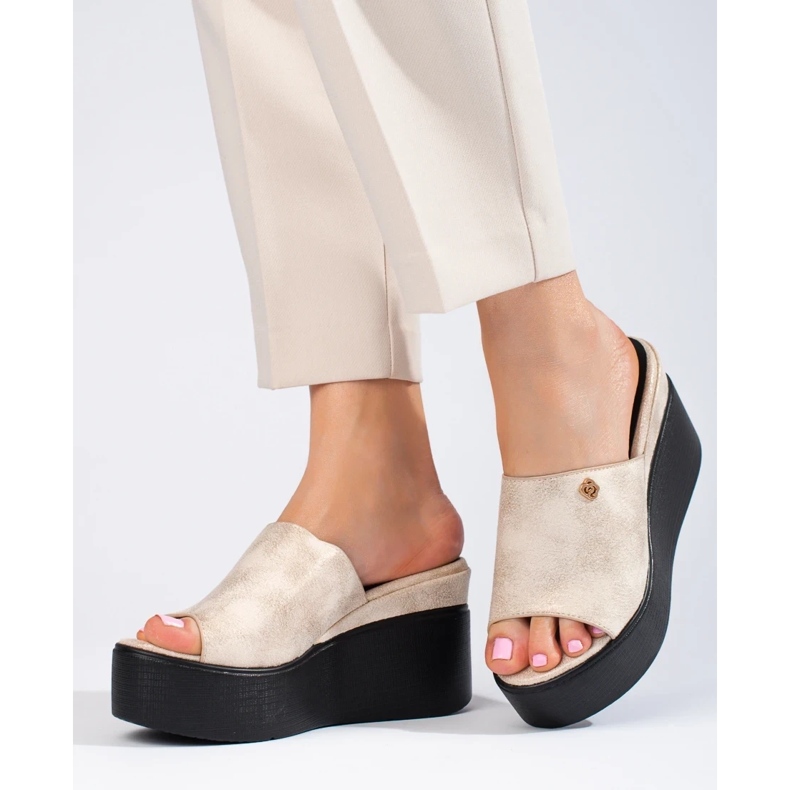 Metallic flip flops on a high wedge golden 1