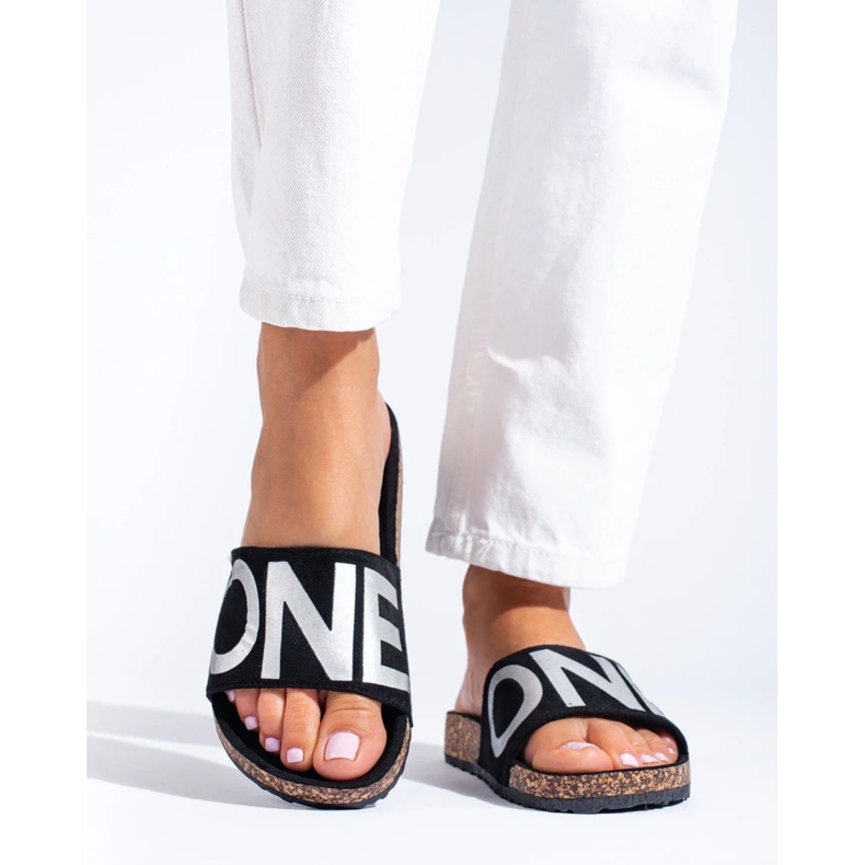 Black flip-flops with silver lettering on the Shelovet cap 2