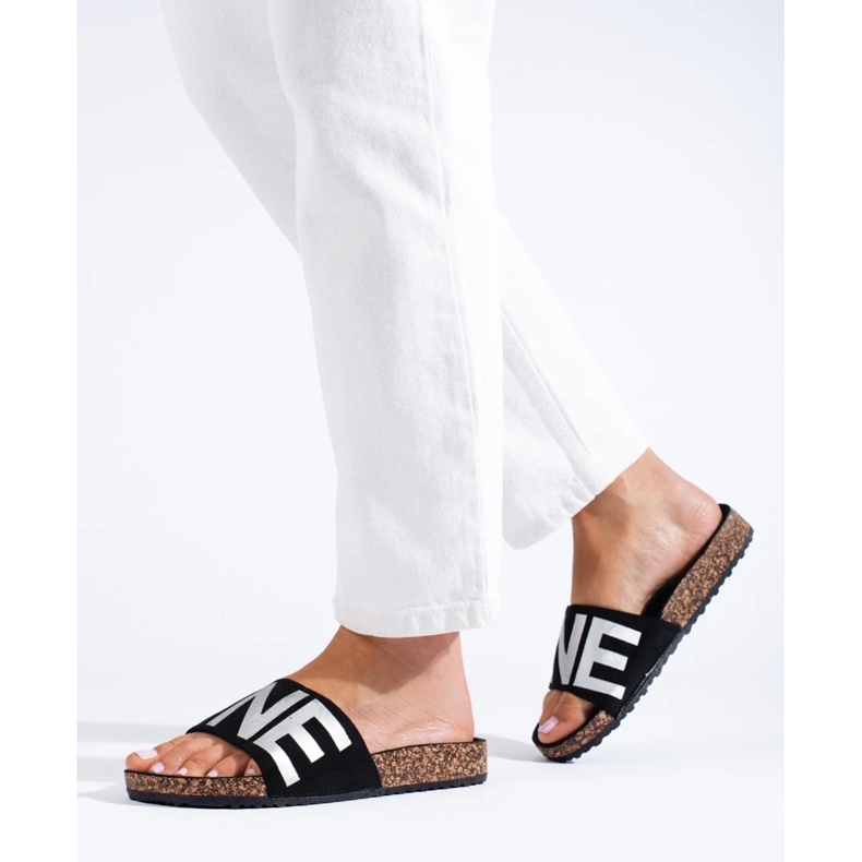 Black flip-flops with silver lettering on the Shelovet cap 1