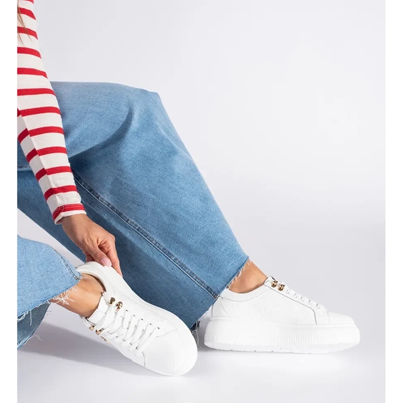 Leather white sneakers on the platform 1