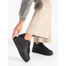 Black sneakers on the platform 2