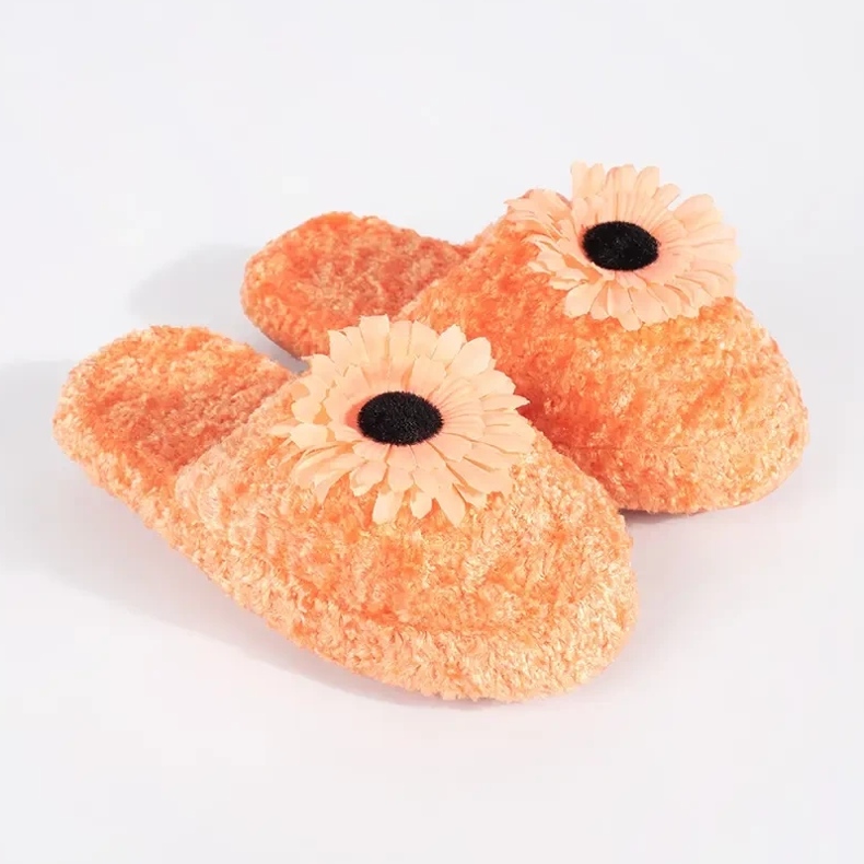 Orange children's slippers with a decorative flower 1