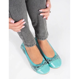 Blue ballet flats with a snake pattern and a bow 1
