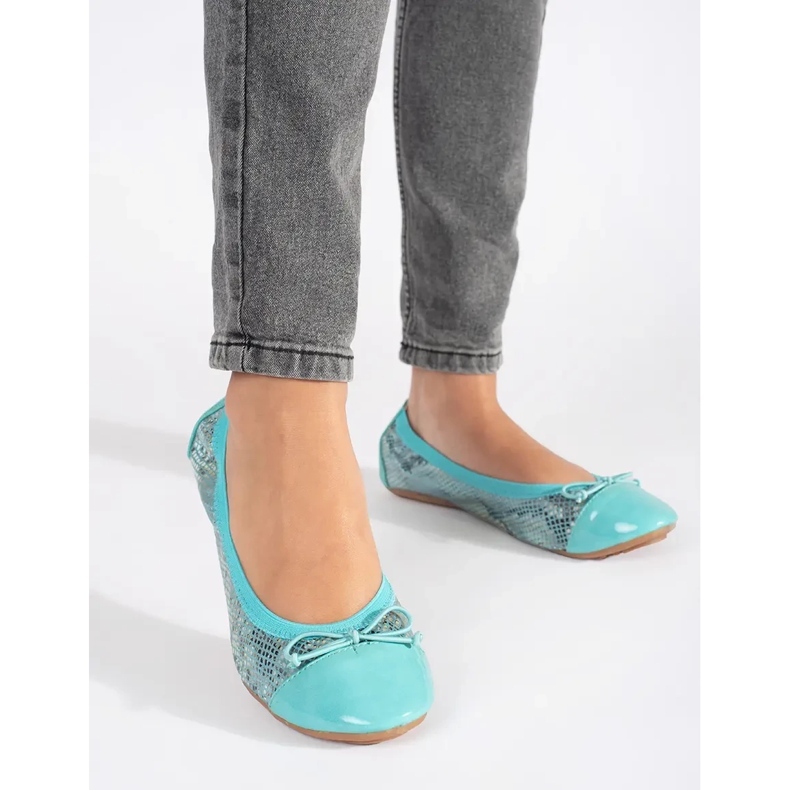 Blue ballet flats with a snake pattern and a bow 2