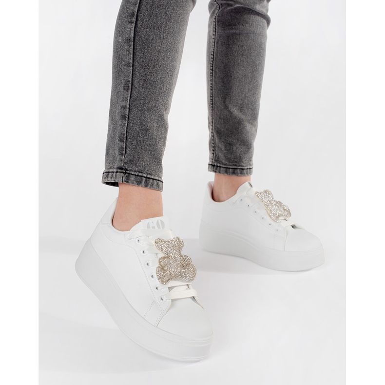 White sneakers on a teddy bear platform 2