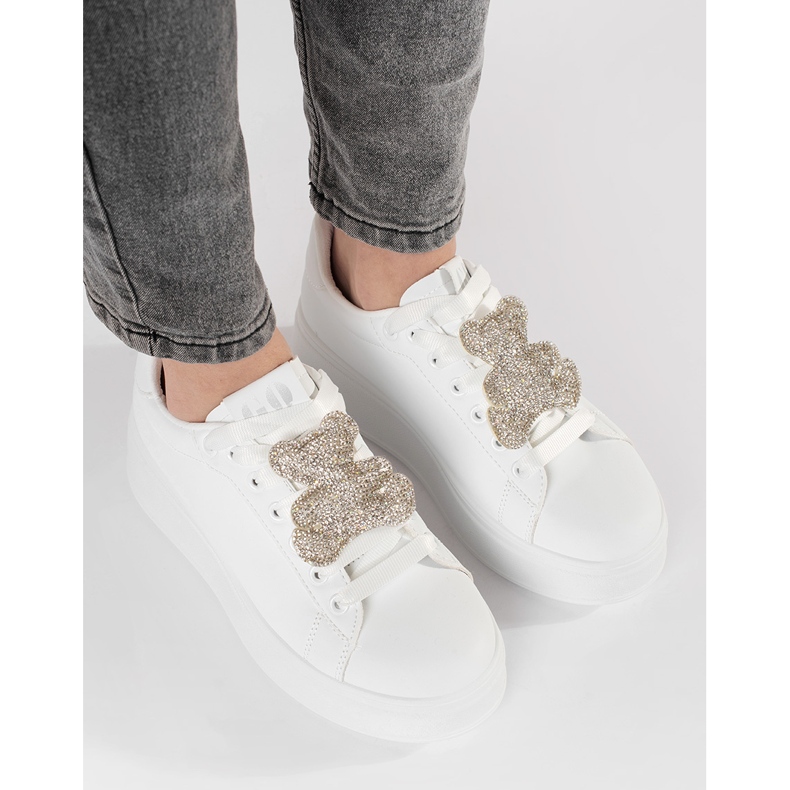 White sneakers on a teddy bear platform 1