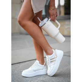 Women's sneakers on the gold platform golden 2