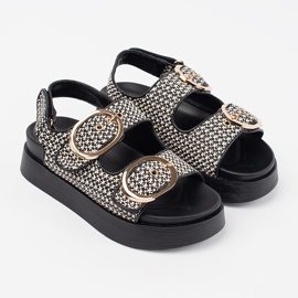Goodin Sandals on a black and white platform 1