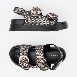 Goodin Sandals on a black and white platform 3