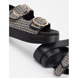 Goodin Sandals on a black and white platform 4