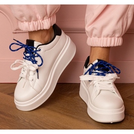 White sports sneakers on the platform 1 White sports sneakers on the platform 1