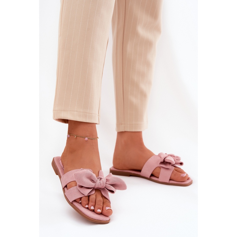 Flat women's flip flops with a pink bow 2