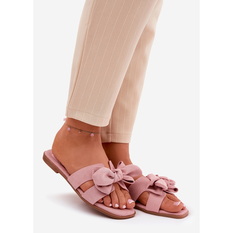 Flat women's flip flops with a pink bow 1