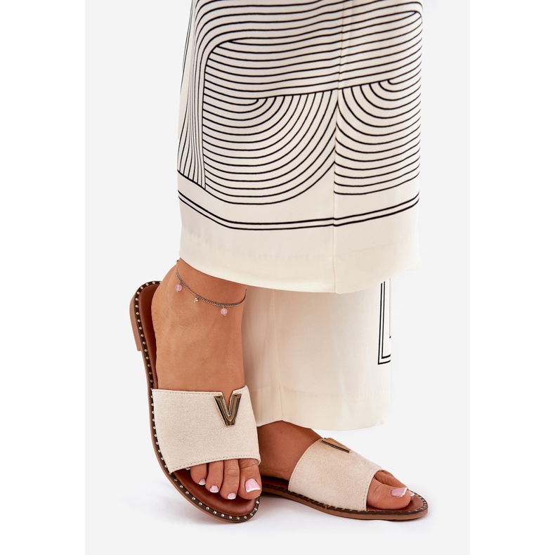 Flat -heeled women's flip flops with decorative details beige 1