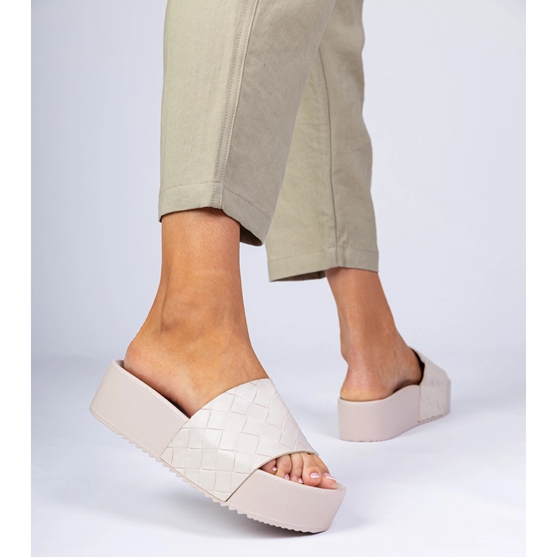Beige pressing flip flops 1