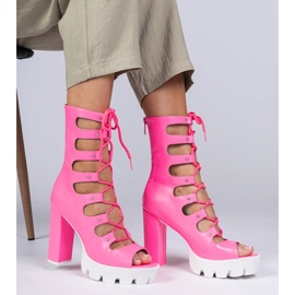 Pink boots on a high pillar with cutouts 2