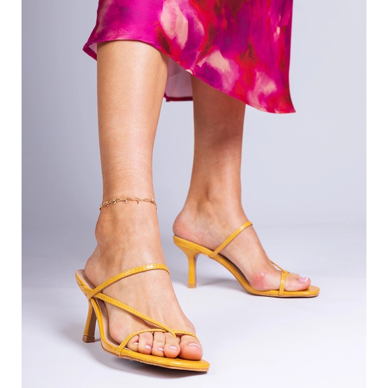 Yellow elegant flip flops on a high heel 1