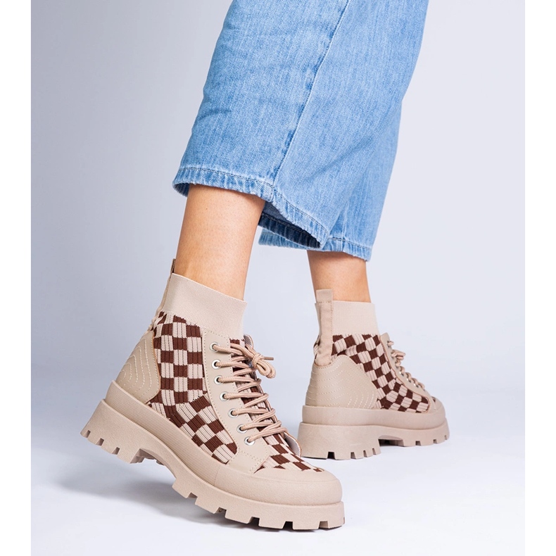 Brown boots sneakers on the platform 1