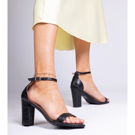 Black sandals on the post 2